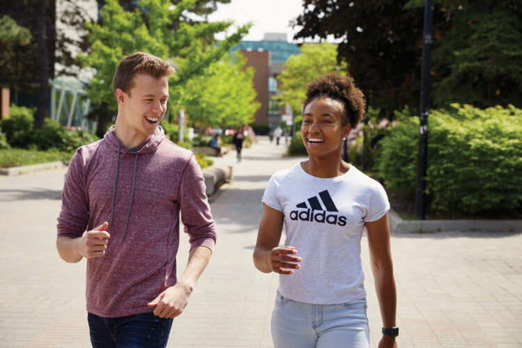 Man and woman walking on campus