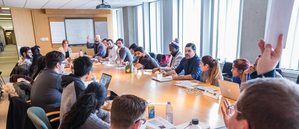 Staff and students meeting in a conference room