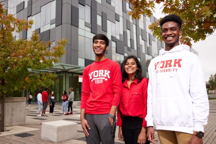 Students standing in front of a building