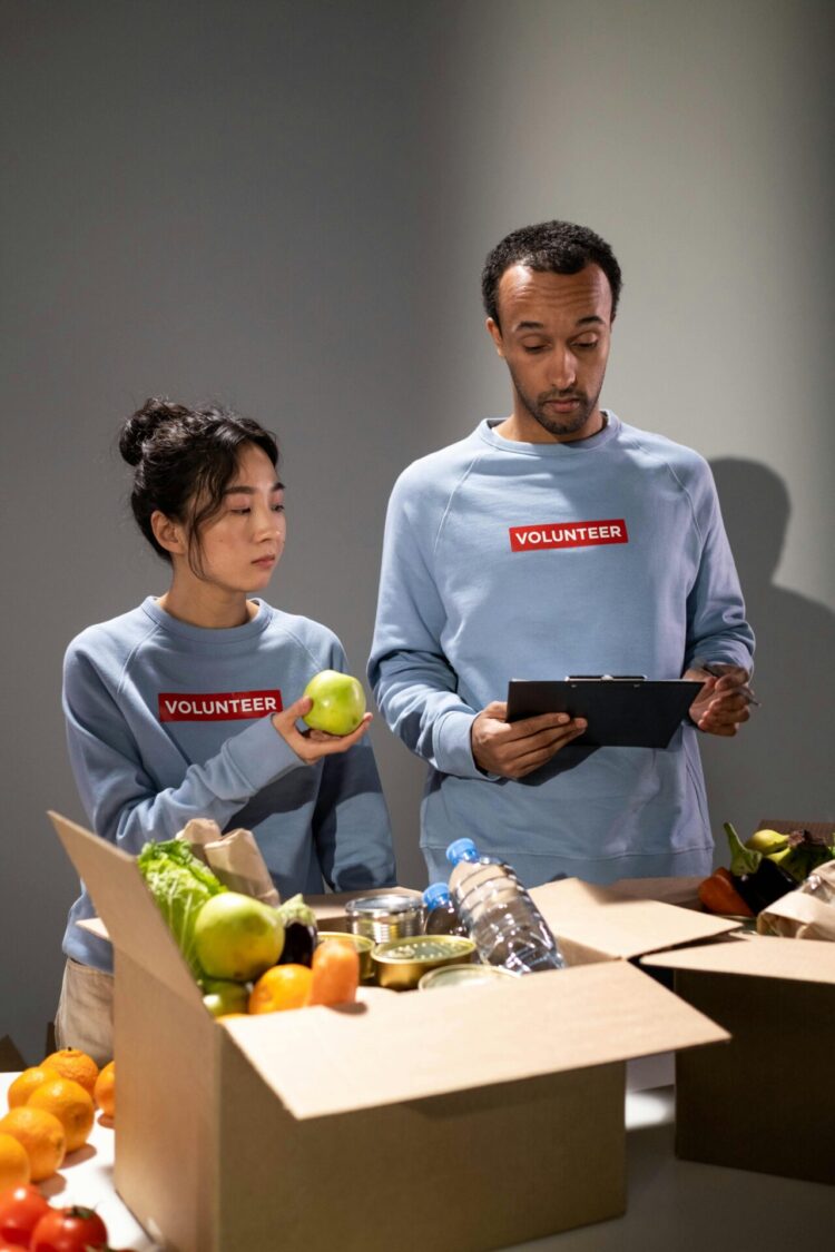 Man and woman checking goods in the box