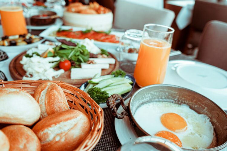 Fried egg beside bread platter