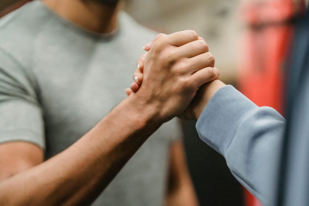 Two people clasping hands