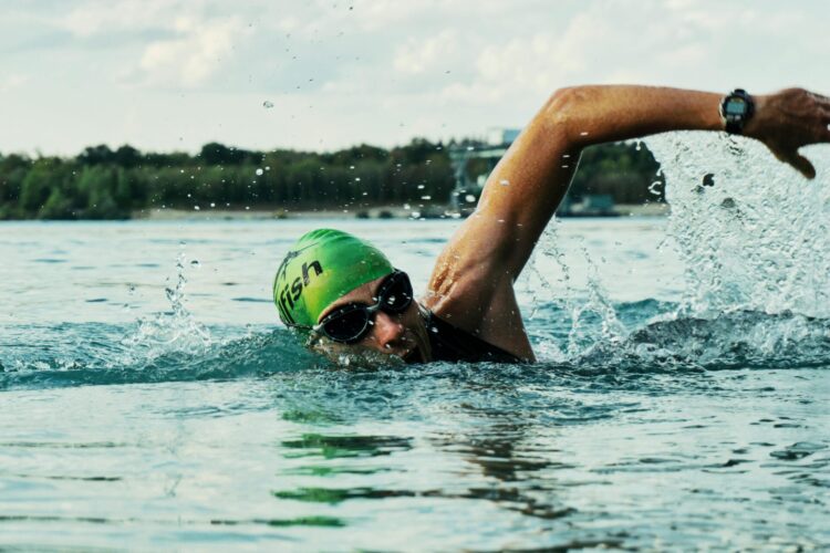 Person swimming in body of water