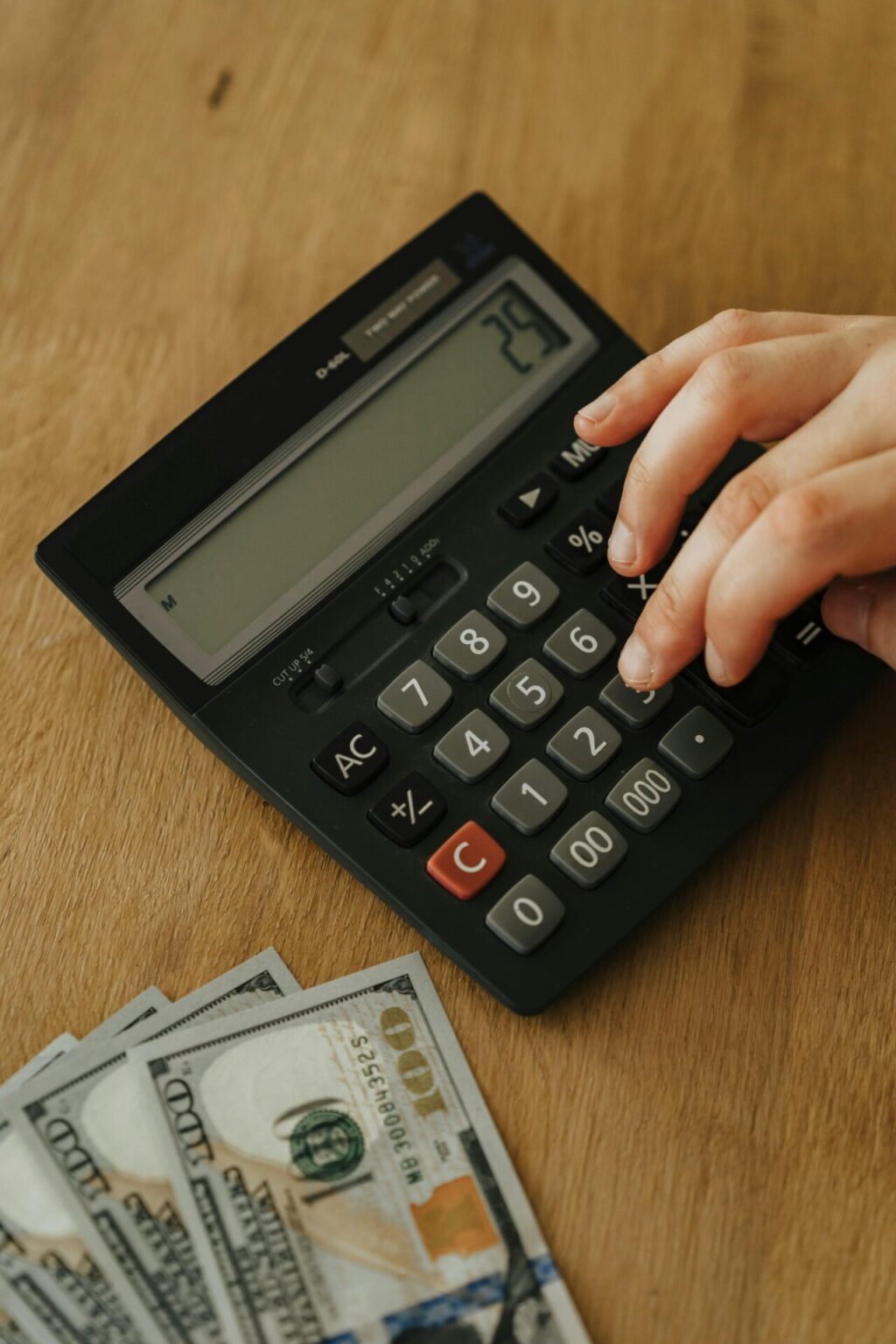 Person using a black calculator