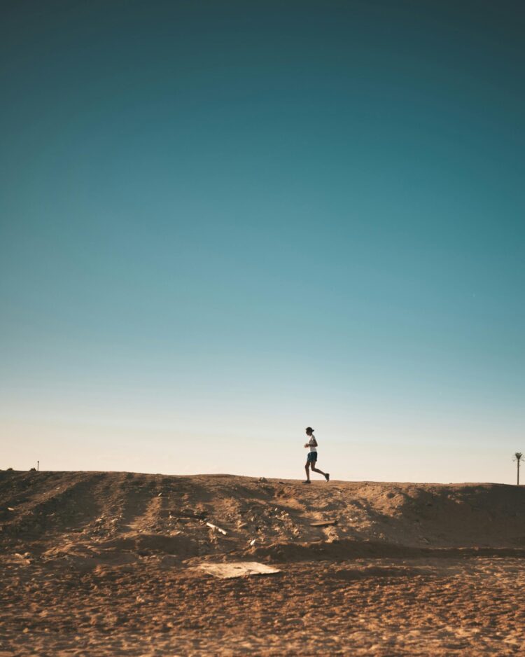 Person running on dirt road