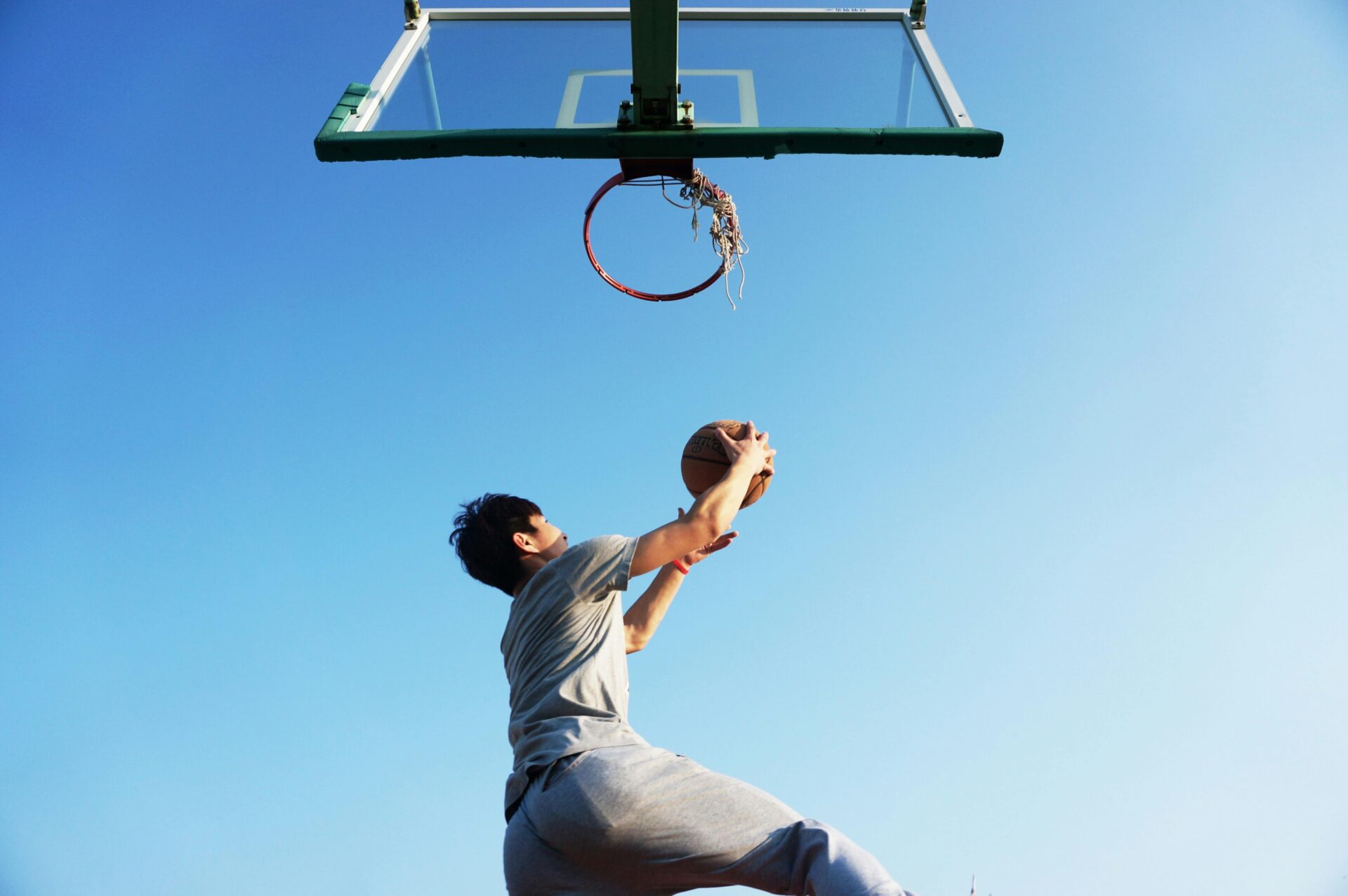 Man dunking a basketball ball