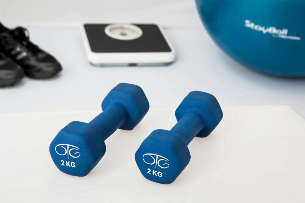 Blue dumbbells on a white surface