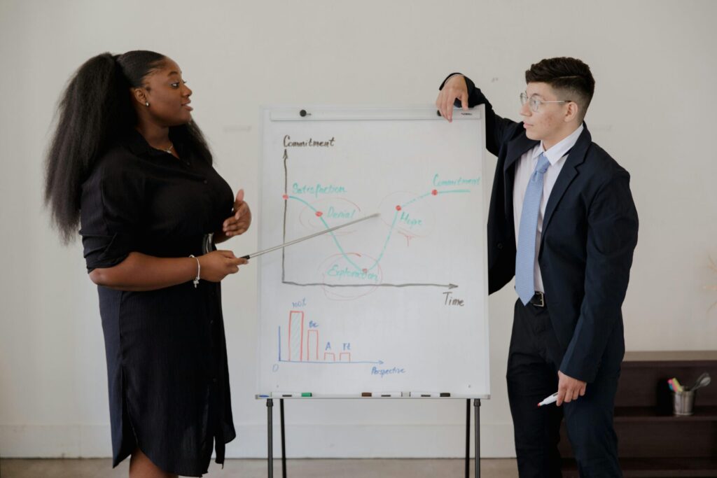 woman and man making presentation in office