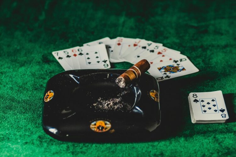 Brown tobacco on black ashtray