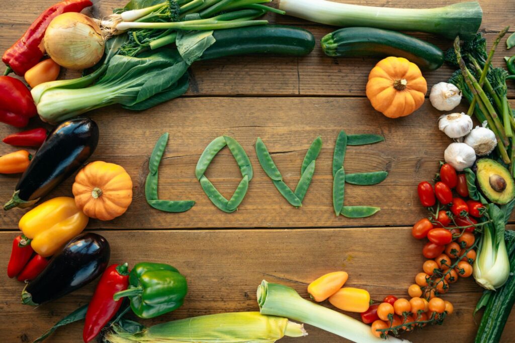 Fresh vegetables and fruits spelling out LOVE