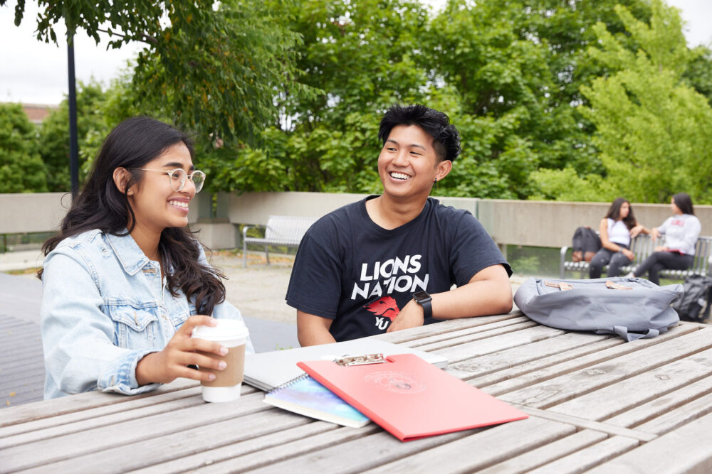 Man and woman sitting at the picnic table