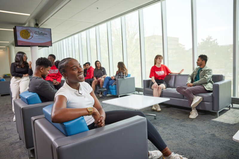 Students sitting in a lobby and chatting