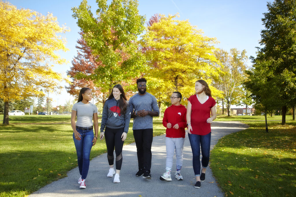 Students walking on a pathway outside