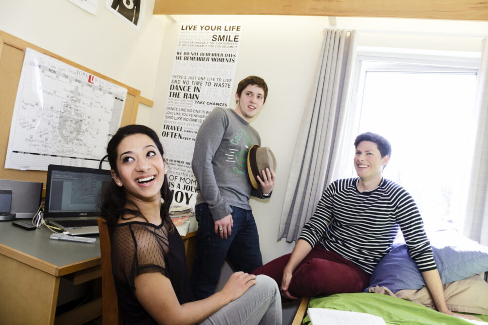 Friends hanging out in the dorm