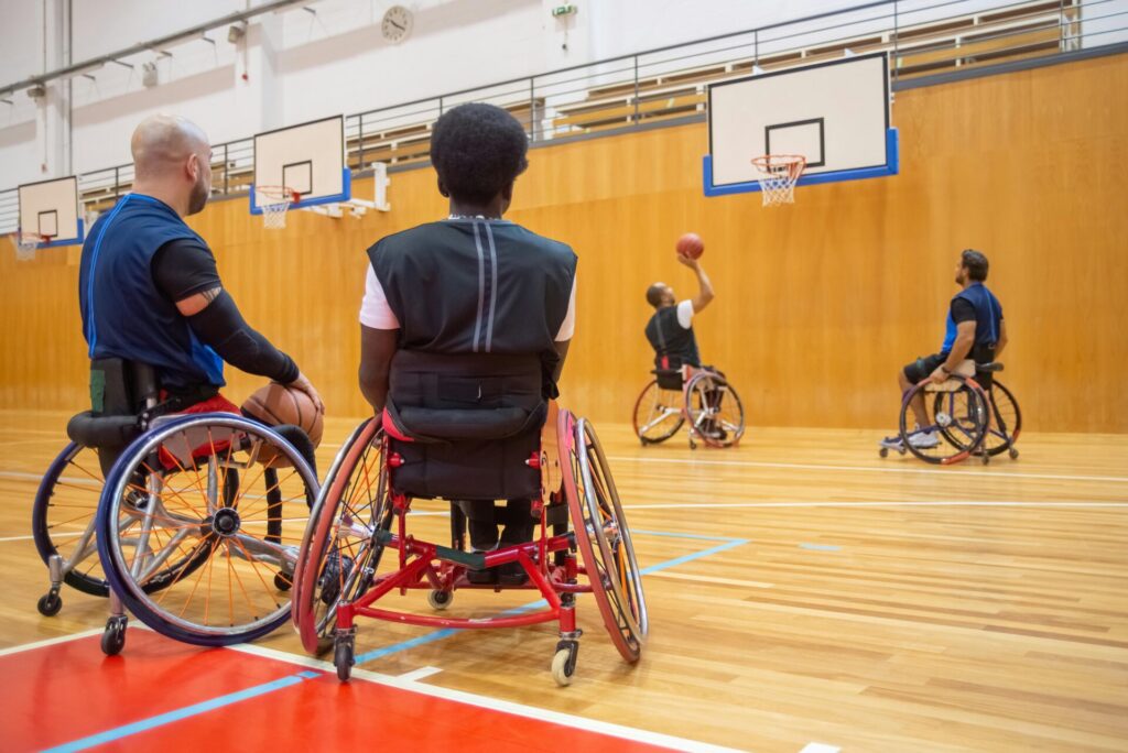 Men on wheelchair playing basketball