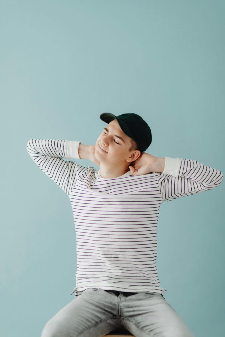 Man sitting on chair stretching