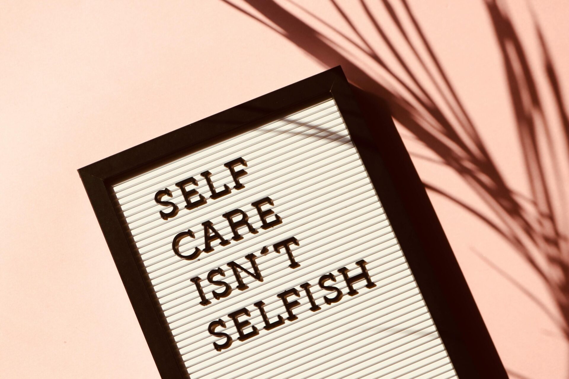 Letter board that says "self care isn't selfish"