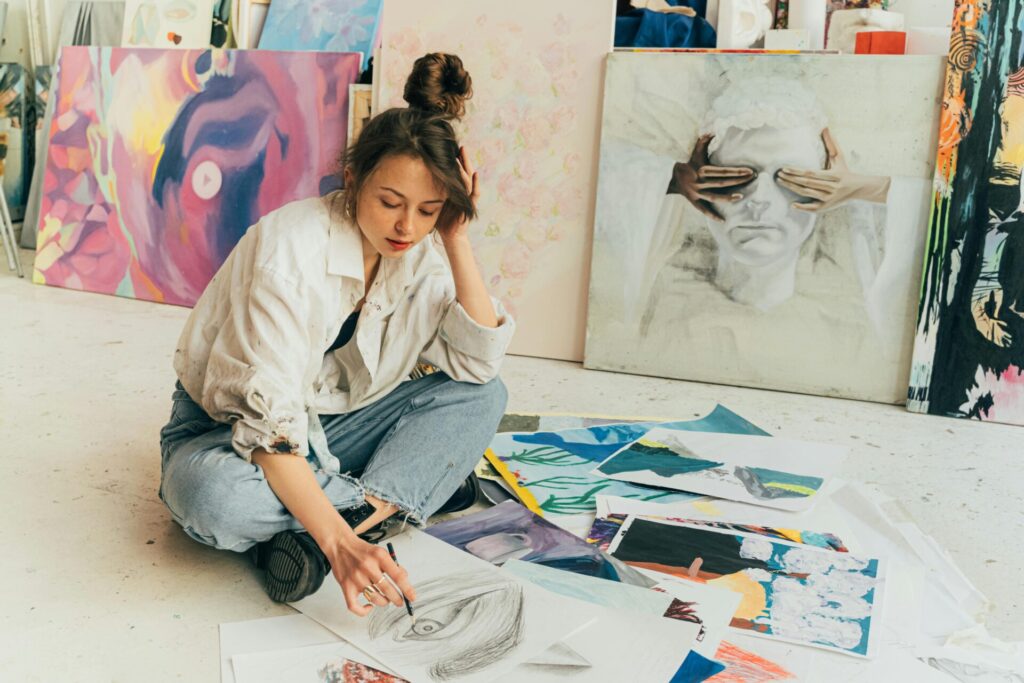 Artist drawing a sketch on the floor