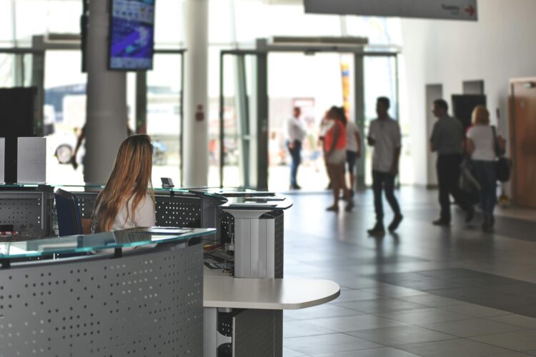 Person sitting behind counter in the lobby