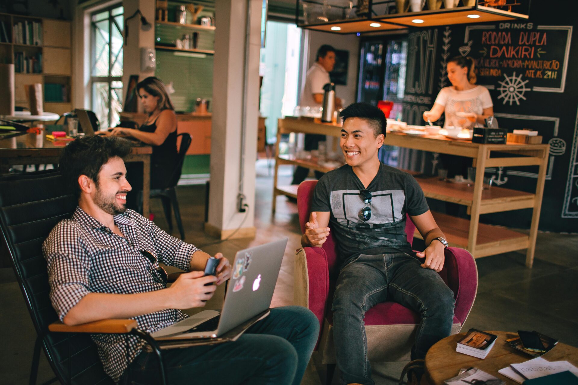 Men having conversation sitting on a chair