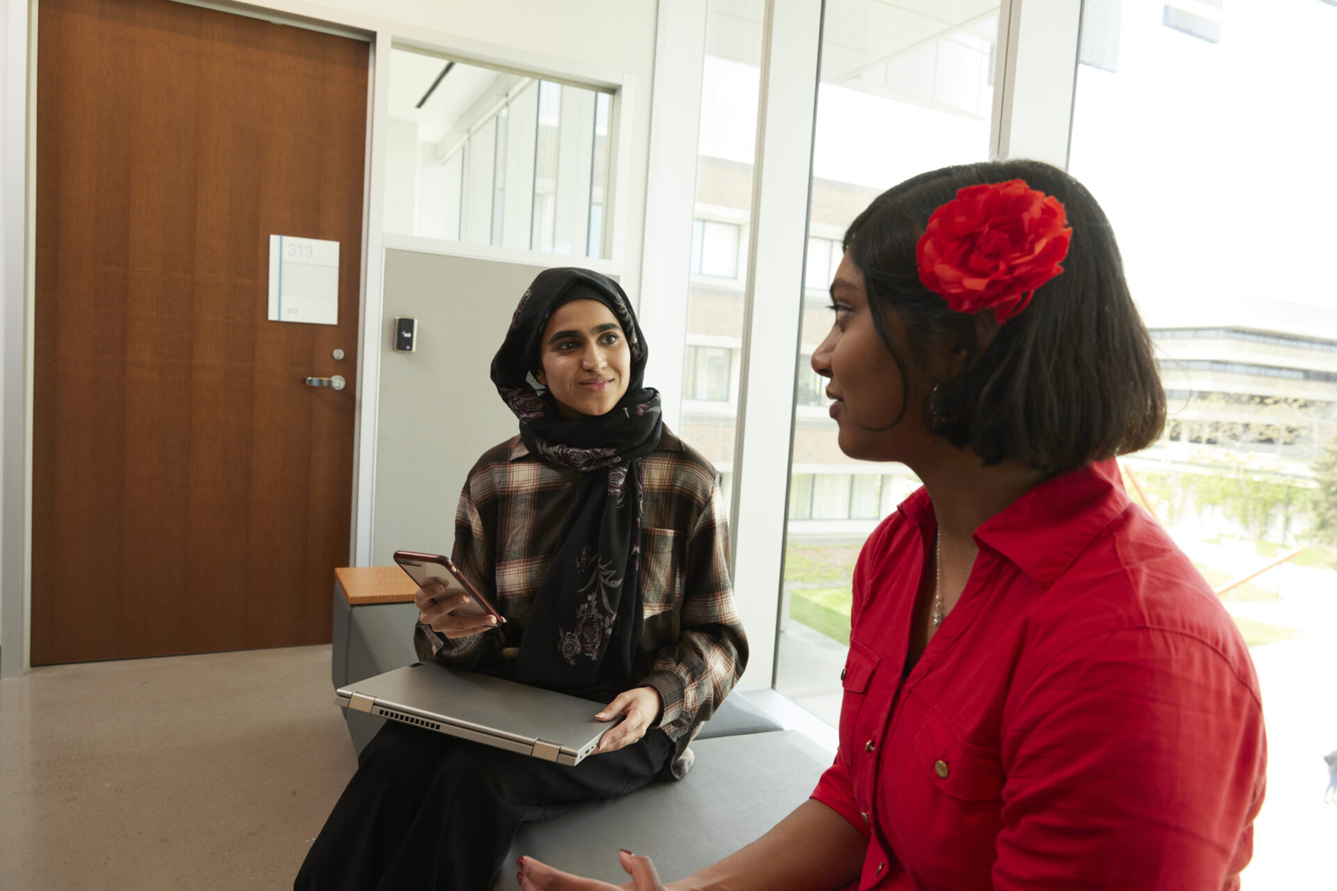 Students talking to each other in student lobby