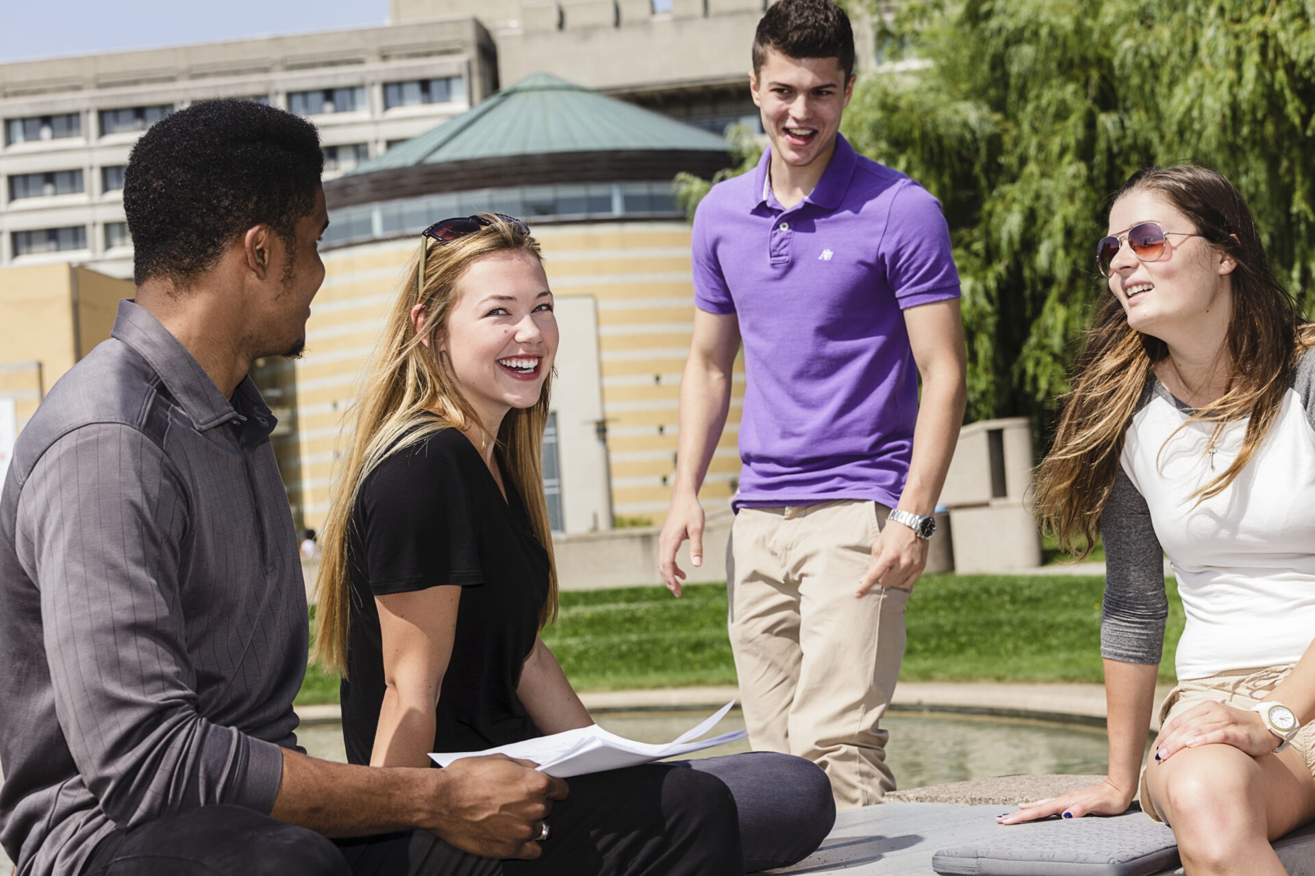 Students sitting outside and talking