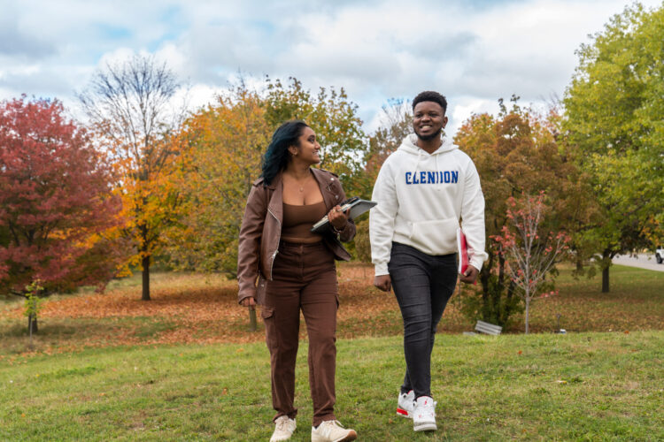 Students walking outside in the autumn