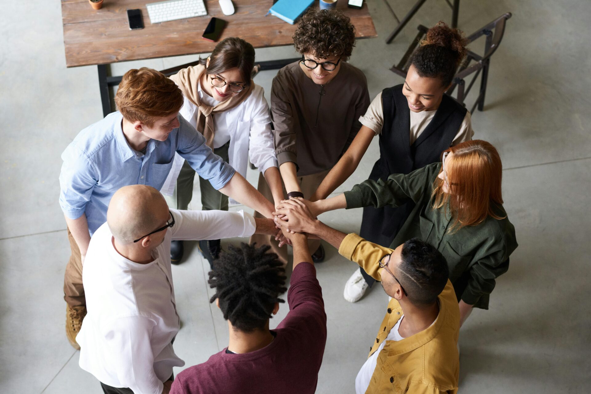 Group of people doing a group hand cheer