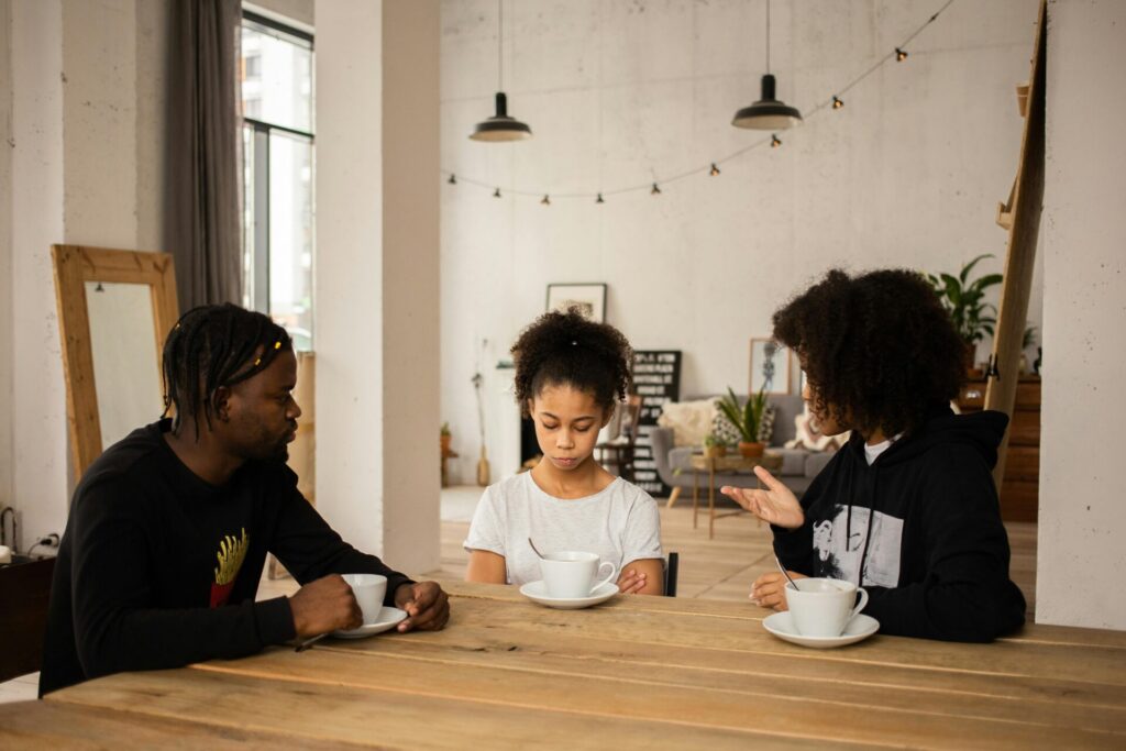 parents talking to upset daughter