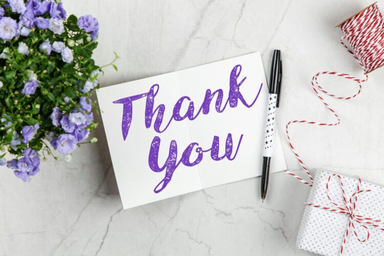 Thank you card with black pen and flowers