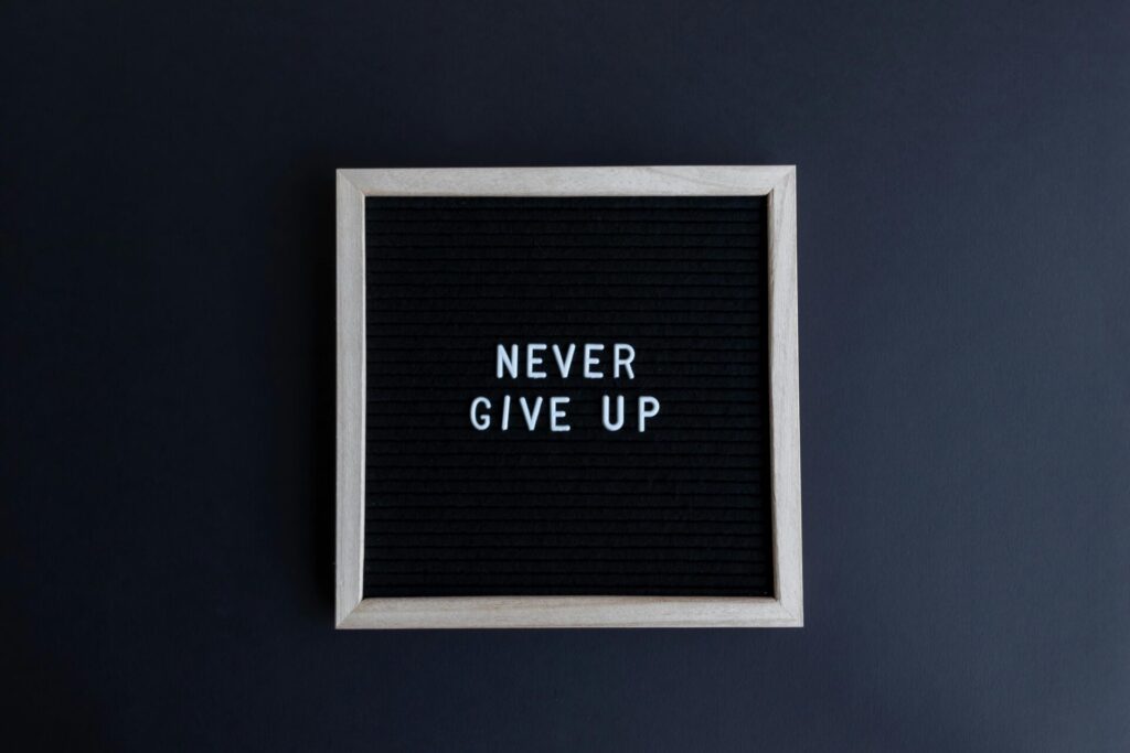 Never give up sign