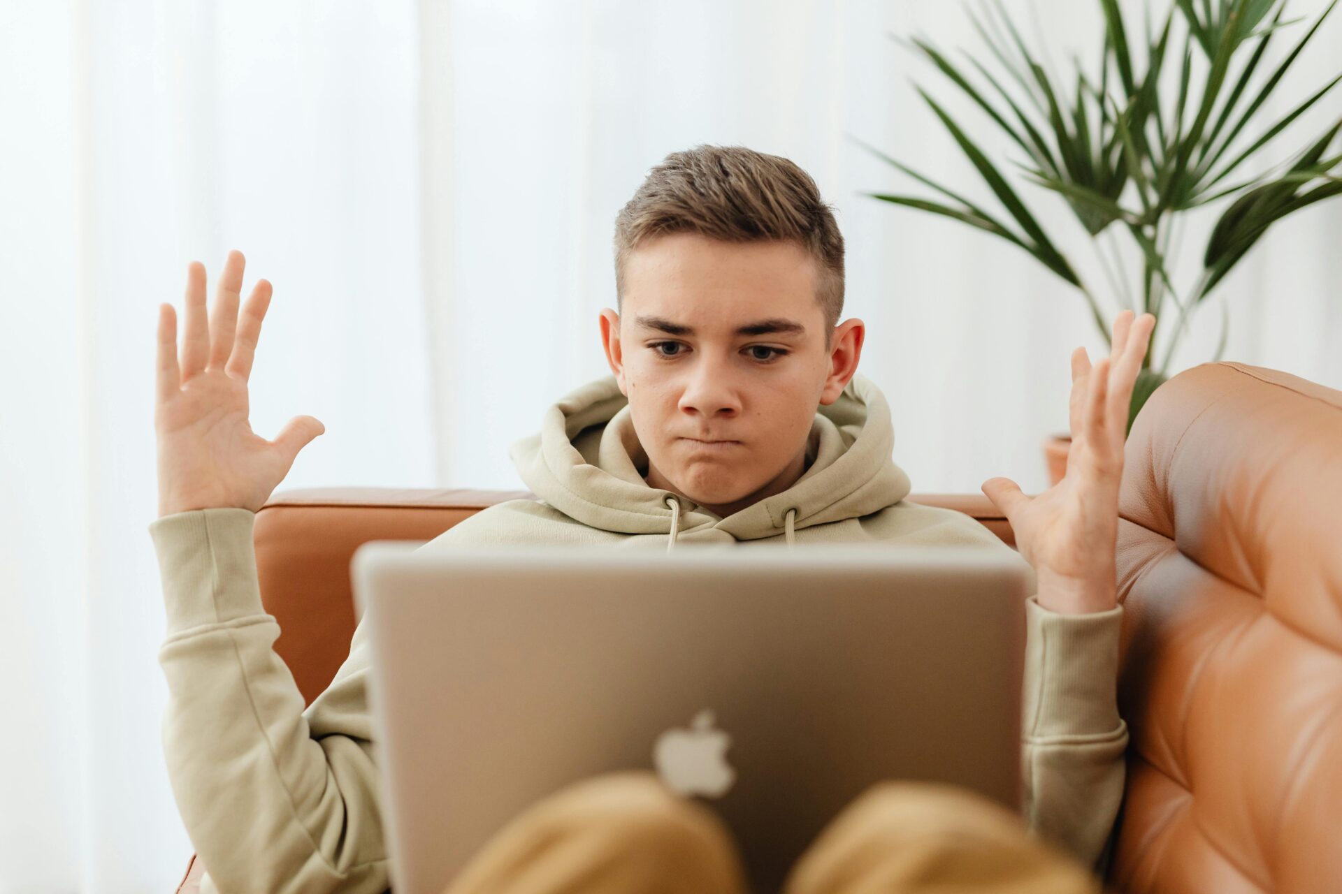 man looking at his laptop stressed