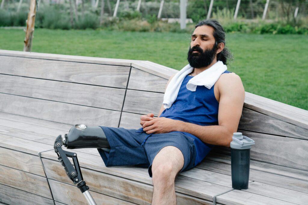 Man resting on wooden bench