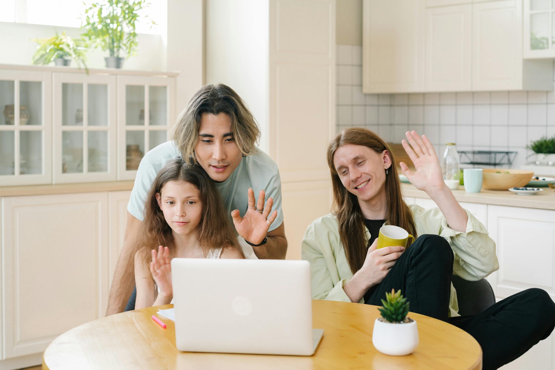 A family engaged in a video call on the computer