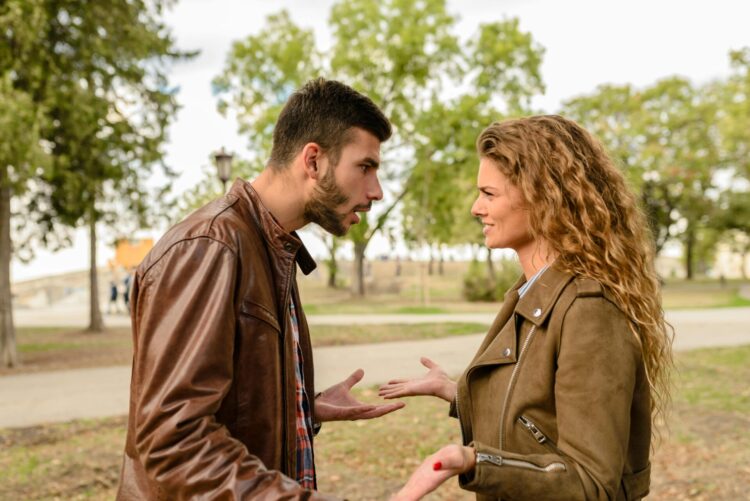 man and woman wearing brown leather jacket