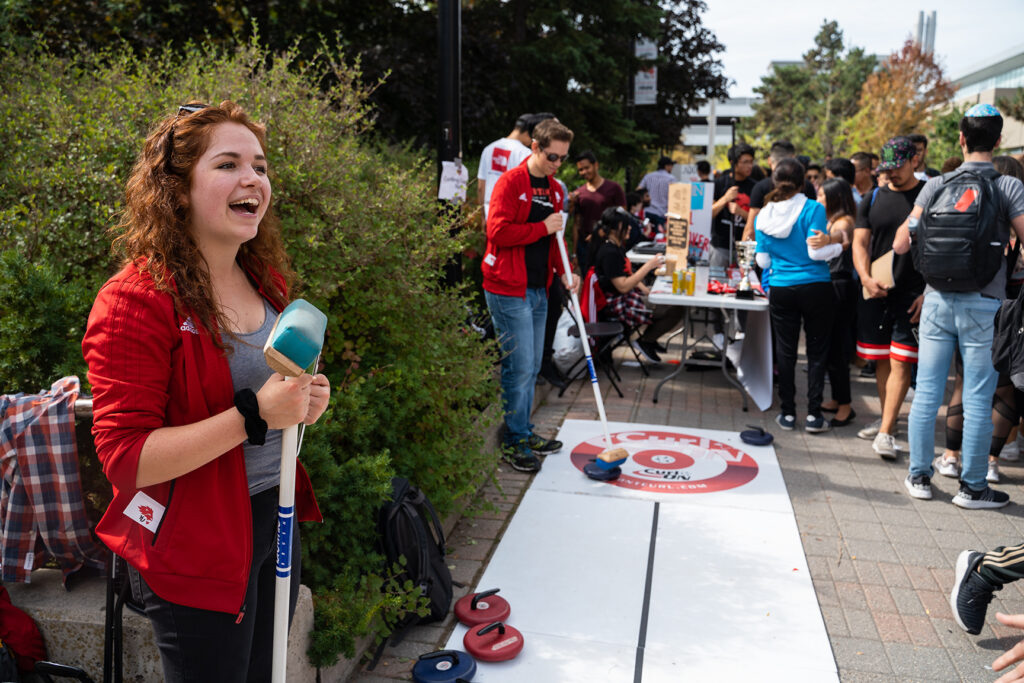 Students playing games at an outdoor campus fair