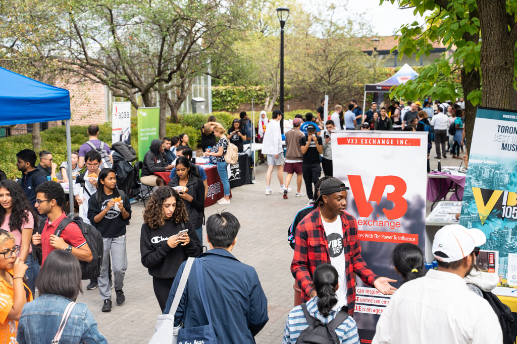 Students walking around at a campus event