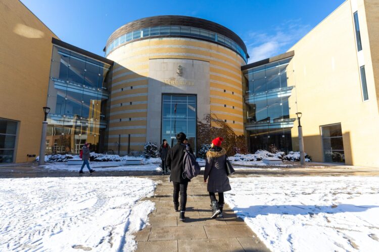 Students walking into Vari Hall