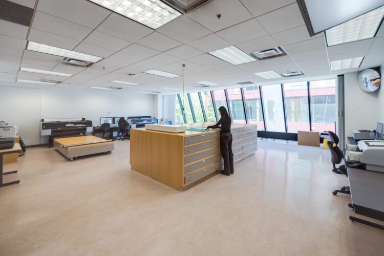 Student employee working at a desk on campus during a work-study shift