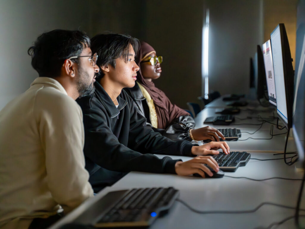 York University students working on campus with a laptop