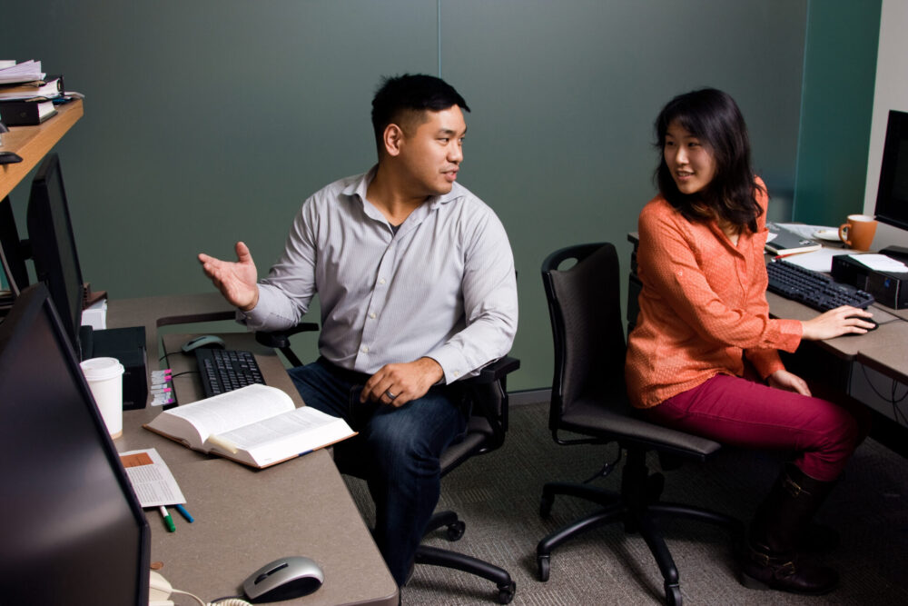 York University students talking to each other while studying