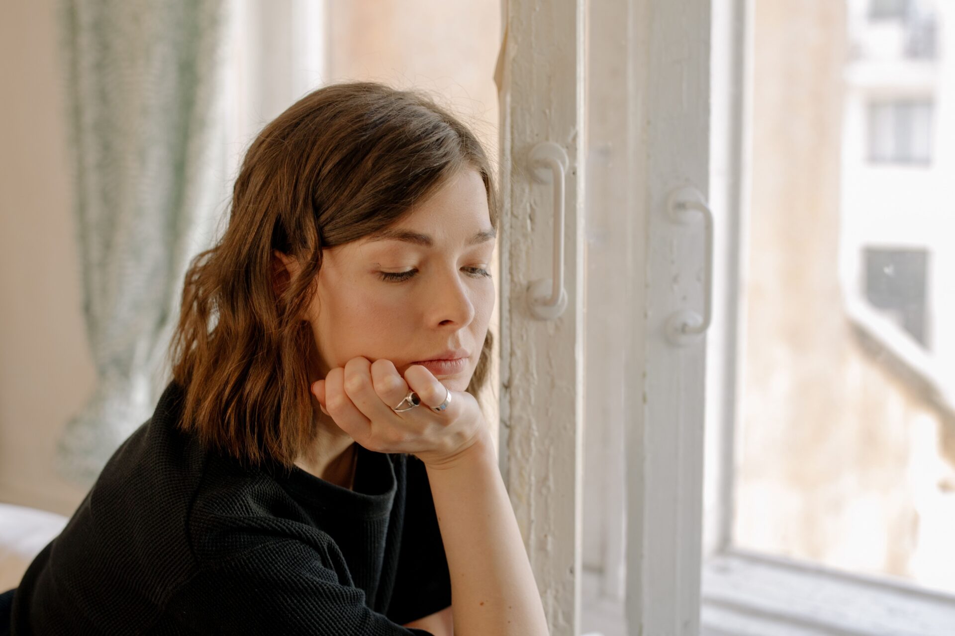 sad by the window